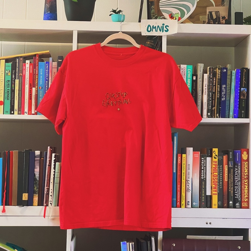 red shirt embroidered art question everything upside down smiley face bead